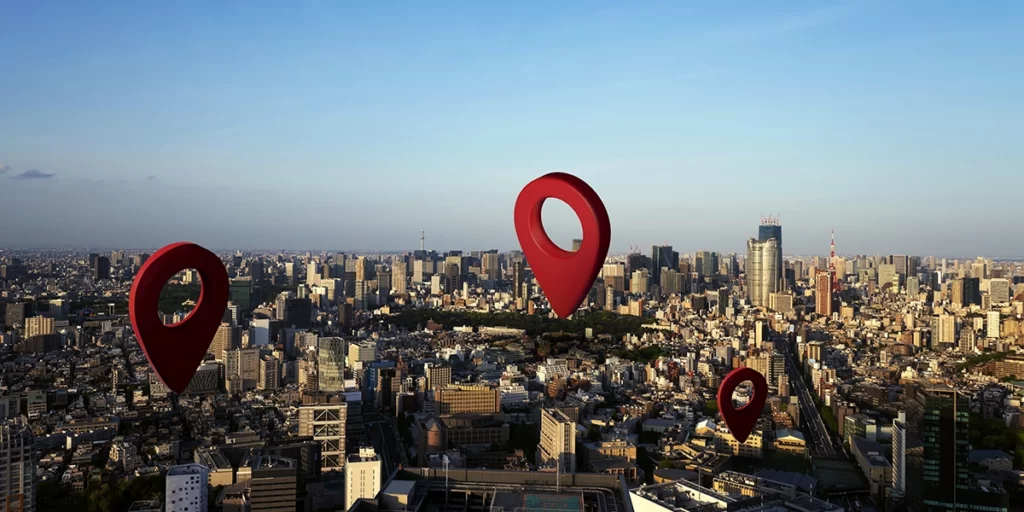 Google localização: imagem de uma cidade vista de cima. Em destaque alguns ícones de localização.